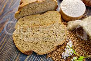 Bread buckwheat with groats and flower on board