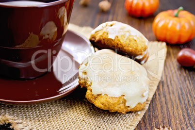 Cookies pumpkin with cup on sacking