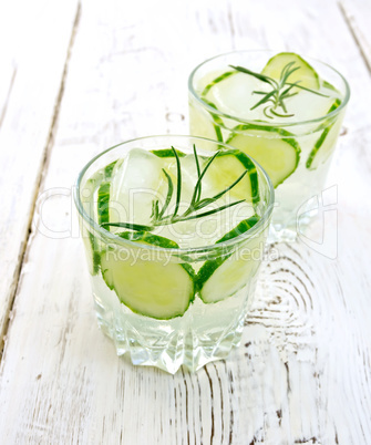 Lemonade with cucumber and rosemary in two glassful on light boa