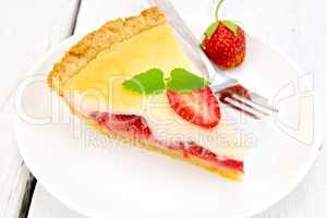 Pie strawberry with sour cream in dish on board