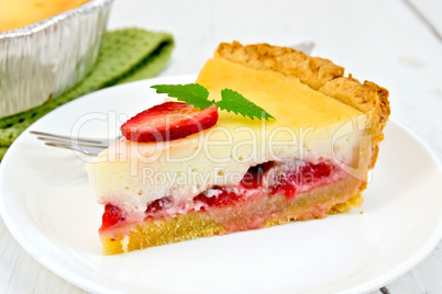 Pie strawberry with sour cream in dish on light board