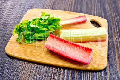 Rhubarb with leaf on board