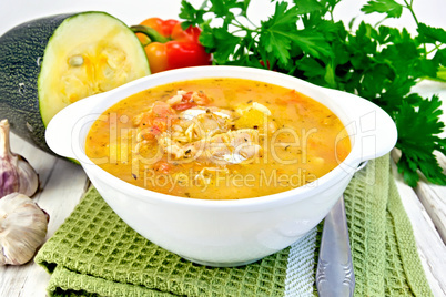 Soup fish with zucchini and peppers on board