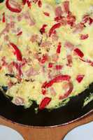 cooking of omelet with red paprika