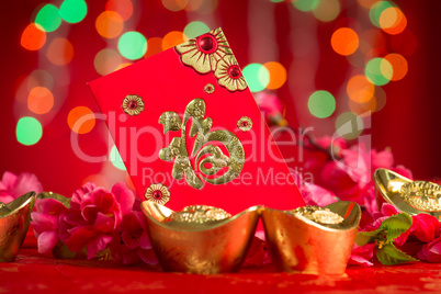 Chinese New Year decorations gold ingots and red packet