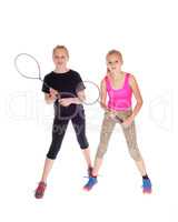 Two girls with tennis racquet.