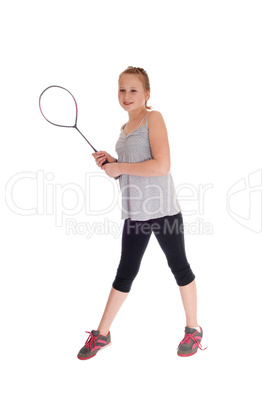 Young blond girl with her tennis racquet.