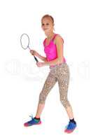 Lovely young girl with tennis racquet.