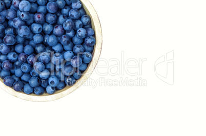 Bowl of blueberries isolated on white