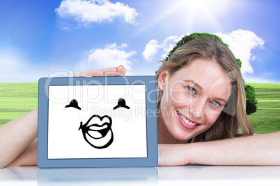 Composite image of woman showing tablet pc