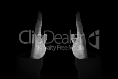 Composite image of businessman holding hand out in presentation Composite image of businessman holding hand out in presentation