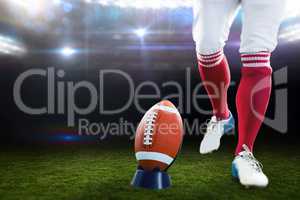 Composite image of american football player being about to kick