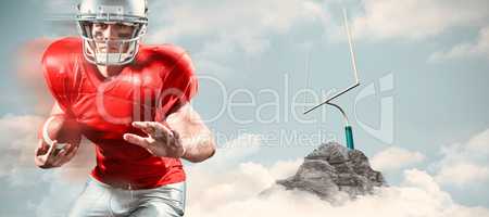 Composite image of portrait of defensive sportsman holding ameri