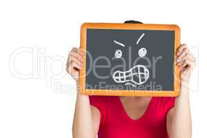 Composite image of woman holding chalkboard over face