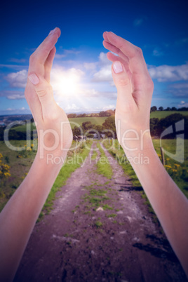 Composite image of woman presenting with her hands