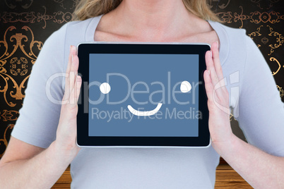 Composite image of portrait of smiling woman with tablet