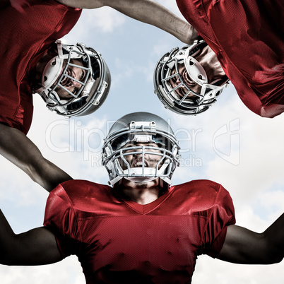 Composite image of american football huddle