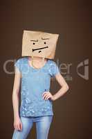 Composite image of woman posing with bag on head