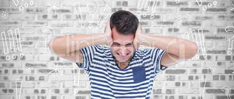 Composite image of frustrated man covering ears