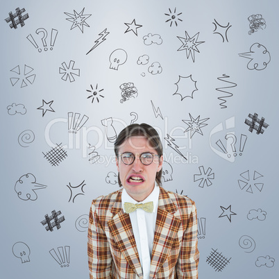 Composite image of furious geeky hipster looking at camera
