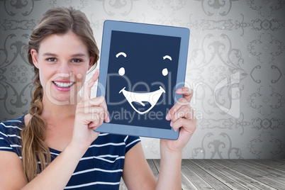 Composite image of woman showing tablet pc