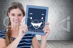 Composite image of woman showing tablet pc