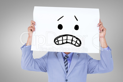 Composite image of  portrait of a businessman hiding his face be