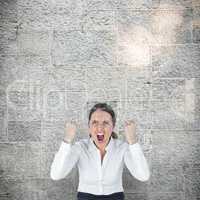 Composite image of portrait of screaming businesswoman clanching