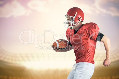 Composite image of american football player playing football