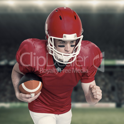 Composite image of american football player running with the bal