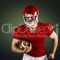 Composite image of american football player holding ball