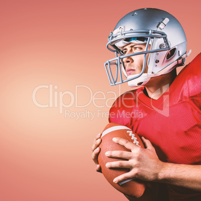 Composite image of determined american football player looking a