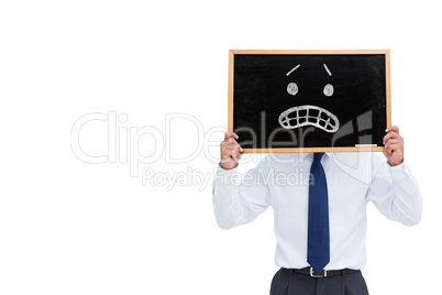 Composite image of businessman showing board