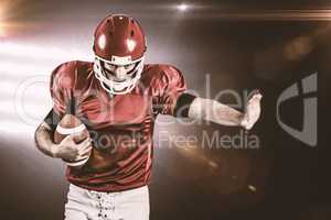 Composite image of american football player wrestling through an