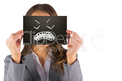 Composite image of businesswoman showing card