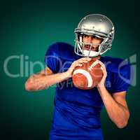 Composite image of american football player holding ball white l