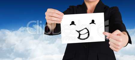 Composite image of businesswoman pointing to card