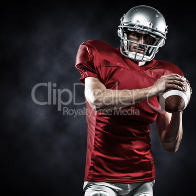 Composite image of confident american football player in red jer