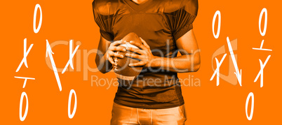 Composite image of mid section of american football player holdi