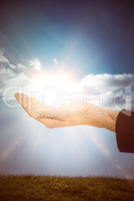 Composite image of close up of businessman with empty hand open