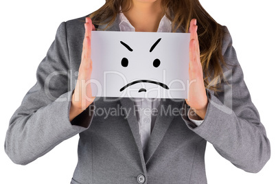 Composite image of businesswoman showing a card