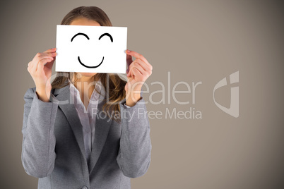 Composite image of businesswoman showing a card