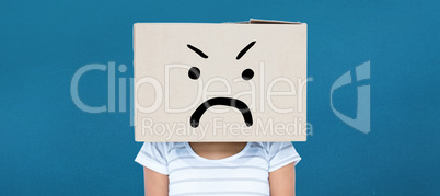 Composite image of depressed woman with box over head