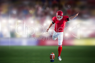 Composite image of american football player kicking football