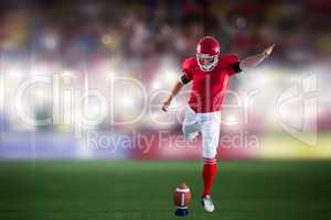 Composite image of american football player kicking football