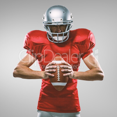 Composite image of furious american football player in red jerse