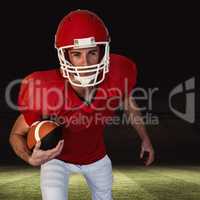 Composite image of rugby player with ball posing