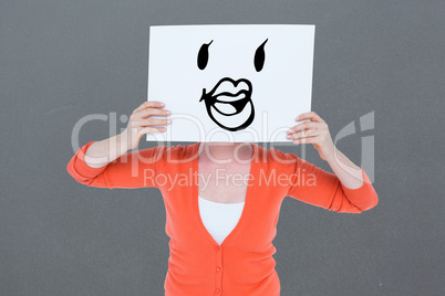 Composite image of woman holdinh blank billboard in front of fac