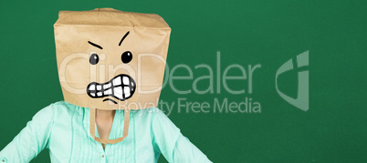 Composite image of woman covering head with brown paper bag