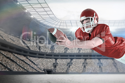 Composite image of american football player scoring a touchdown